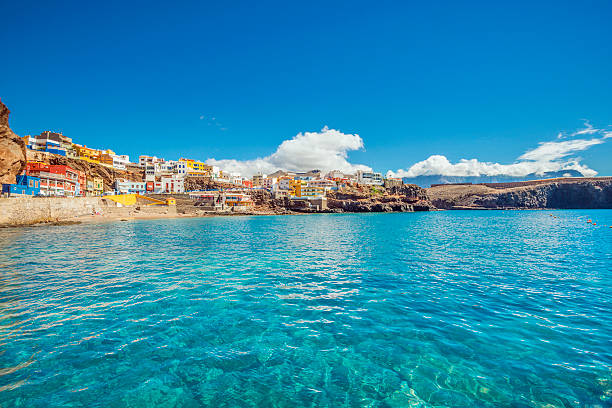 Northern Gran Canaria - Beautiful fishing village Sardina del Norte Cristall clear water and unspoiled canarian landscape at the beautiful fishing village of Sardina del Norte with its colorful houses.  canary stock pictures, royalty-free photos & images