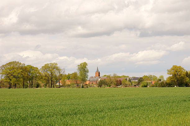 istock Village with church tower 493157496