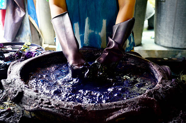 People working Batik dye Mauhom color