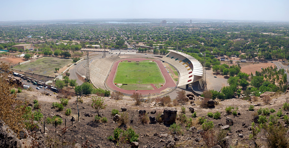 Bamako, Mali - January 7, 2011: Panoramic and wide angle view of the Stadium in Bamako during the day with the city of Bamako in the background.