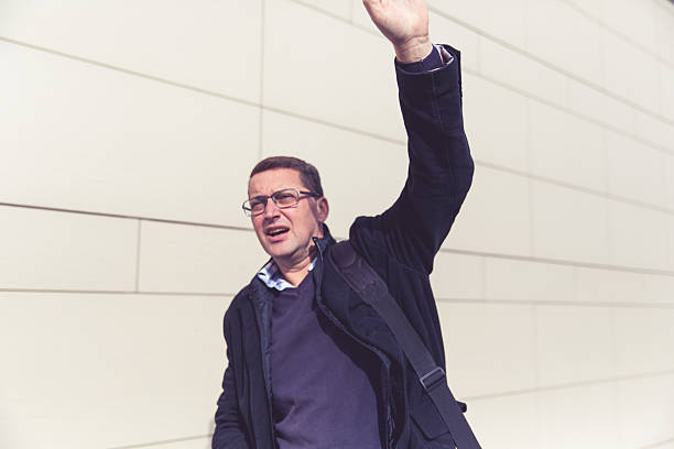 istock Businessman on city sidewalk 493163528