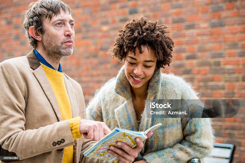 Looking for Directions Couple using map to see where they should go. 2015 Stock Photo