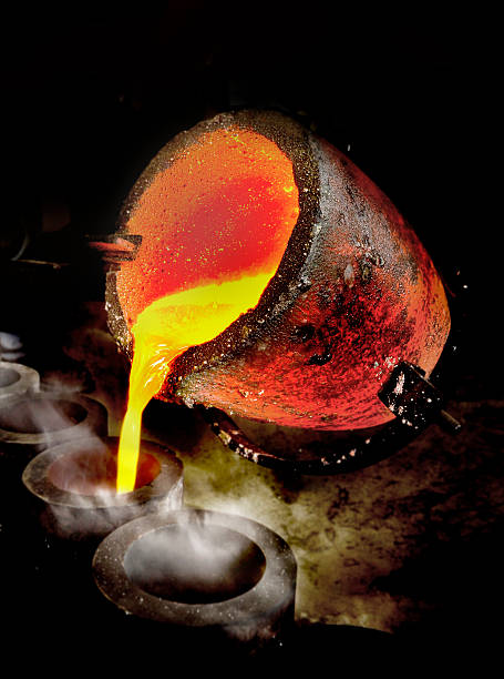 Liquid Molten Steel Industry Liquid metal being poured out of crucible. molten silver stock pictures, royalty-free photos & images