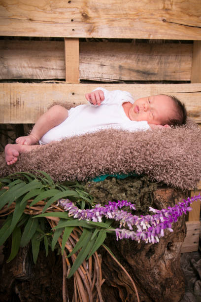 istock Baby in white on nature background 493172517