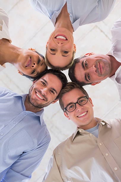 istock Happy young business team in huddle 493174089