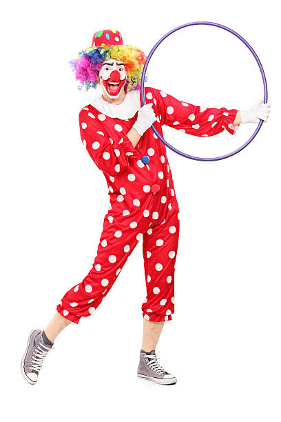 istock Male clown holding a hula hoop 493175079