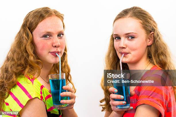 Two Teenagers Drink Blue Soda Stock Photo - Download Image Now - Soda, 16-17 Years, 18-19 Years