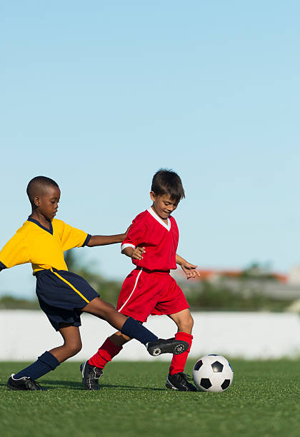istock Two Young Boys Playing Football 493178447