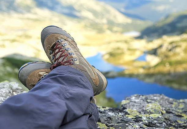 istock Woman Hiker Boots Resting on Mountain Peak 493181112