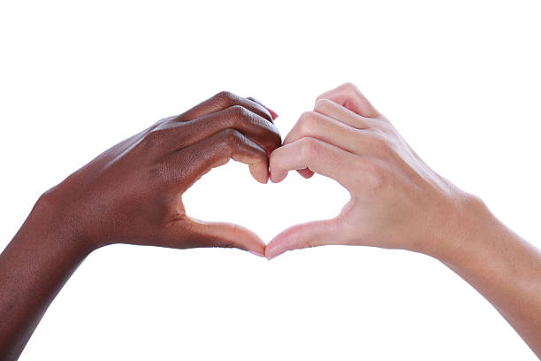 istock White and black hands building a heart shape 493181286