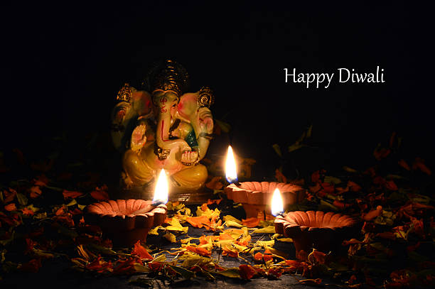istock Clay diya lamps lit during diwali celebration. Greetings Card. 493182370