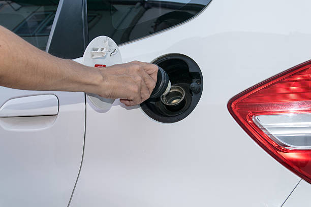 istock Hand opening the oil filler cap 493182542