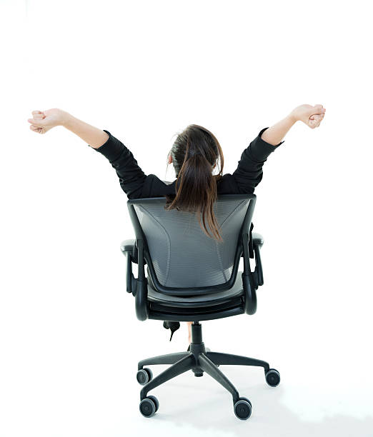 geschäftsfrau arme hoch - office chair cheering ecstatic success stock-fotos und bilder