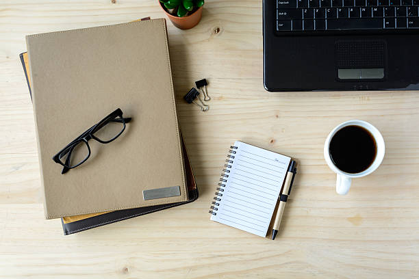 istock Stack of folder with coffee nad laptop on wooden desk 493183920