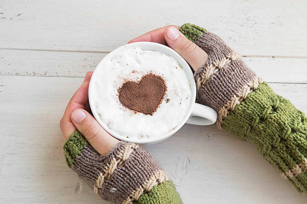 istock Holding Coffee Latte with Cozy Wool Hand Warmers 493184930