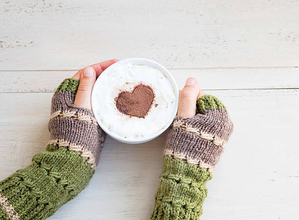 istock Holding Coffee Latte with Cozy Wool Hand Warmers 493186194