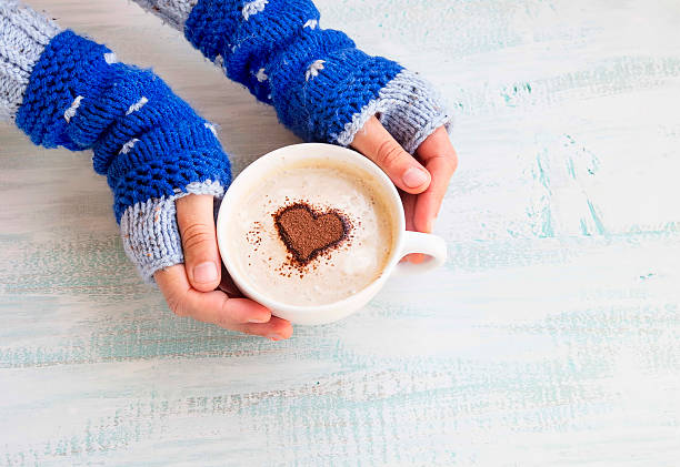 istock Holding Coffee Latte with Cozy Wool Hand Warmers 493186268
