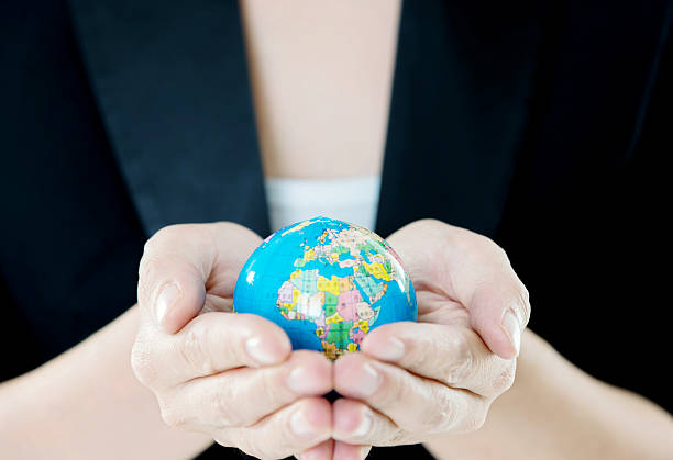 istock Businesswoman hands holdong a globe 493187250