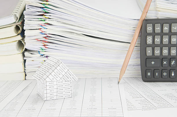 istock House and blur pencil lean on calculator 493188164