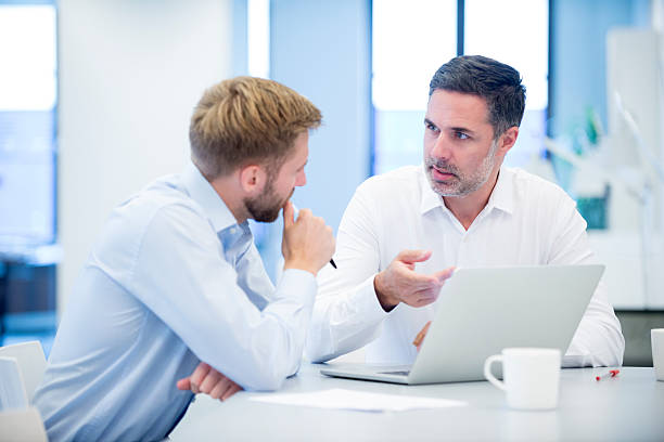 istock Businessmen discussing business project in modern office 493188240