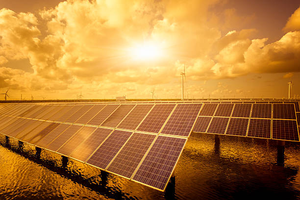 istock solar energy panels and wind turbines 493188880