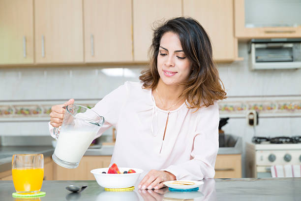 istock Attractive woman having breakfast 493190874