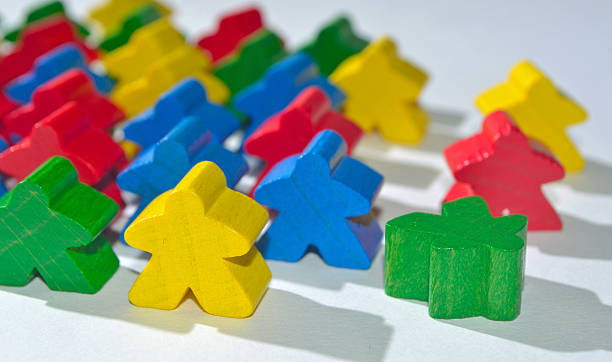 istock Little multi colour wooden human figures or meaples. 493191352