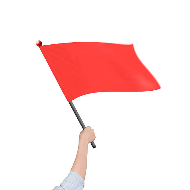 istock Female hand holding red flag isolated on white 493191596