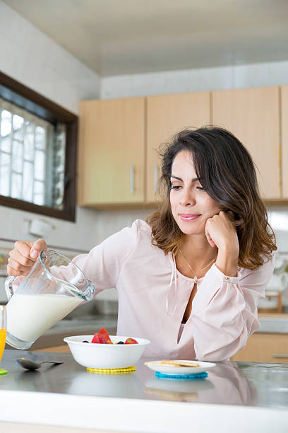 istock Attractive woman having breakfast 493191858