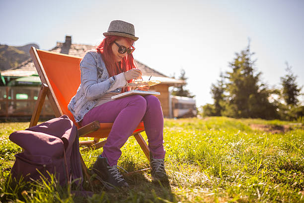 Girl painting in the open