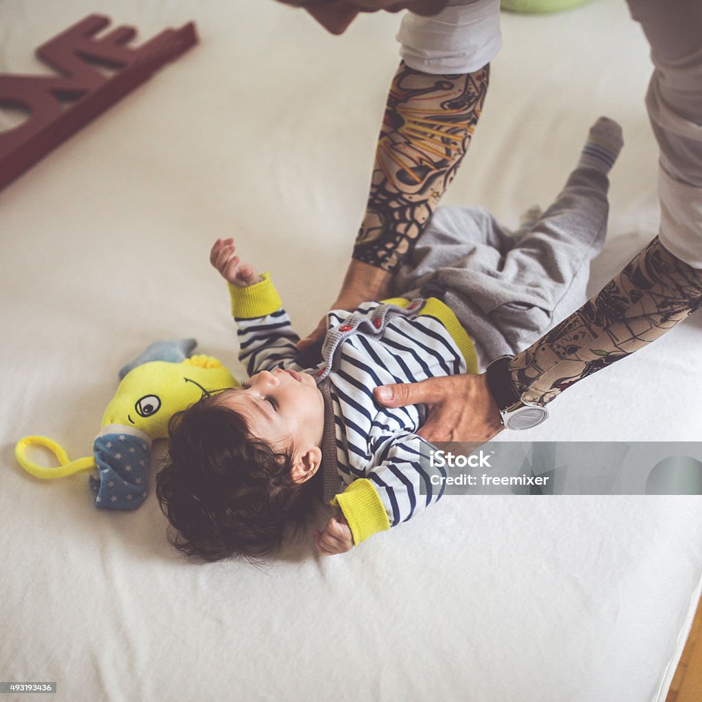 Responsible fatherhood Shot of a young father holding his baby newborn. 2015 Stock Photo