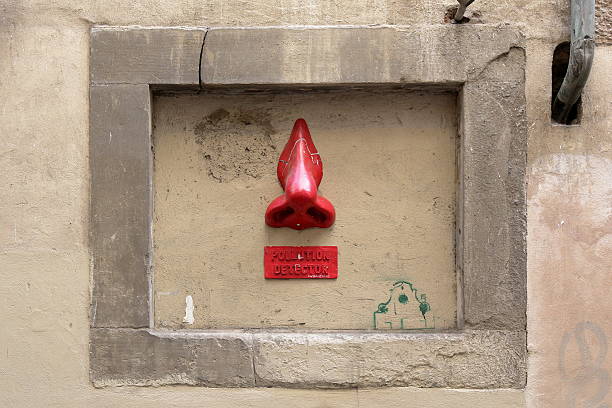 istock Red nose on yellow wall 