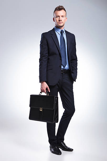 istock young business man holds his suitcase 493200351