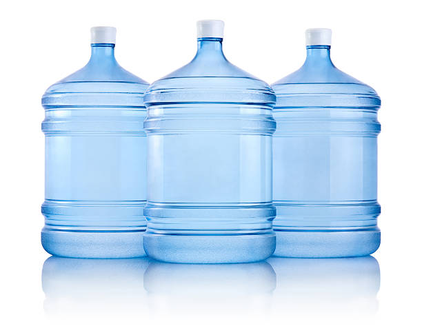 istock Three big bottles of water isolated on a white background 493201469