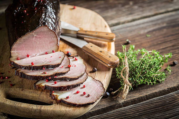 istock Freshly smoked ham in a rural pantry 493201597