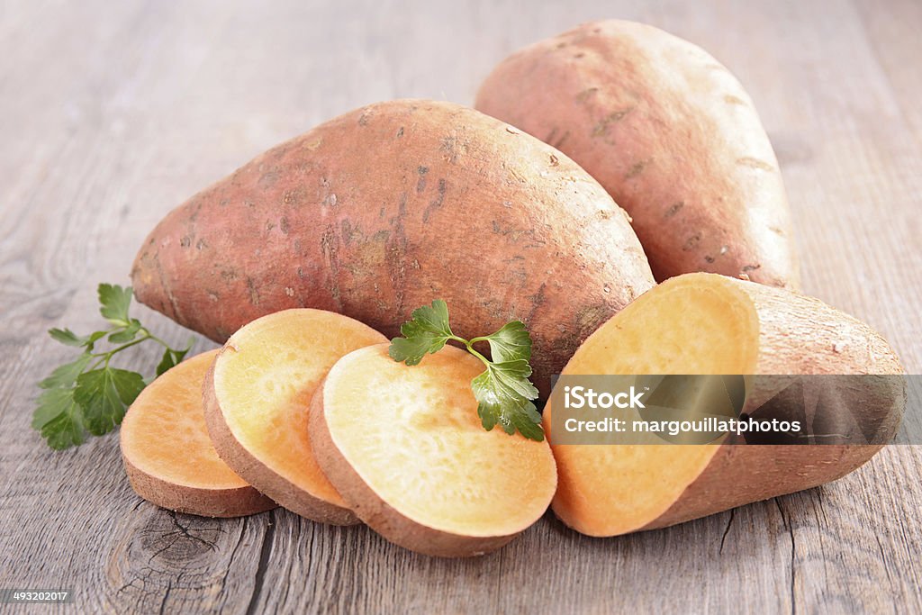 sweet potato sweet potato on wood background Agriculture Stock Photo