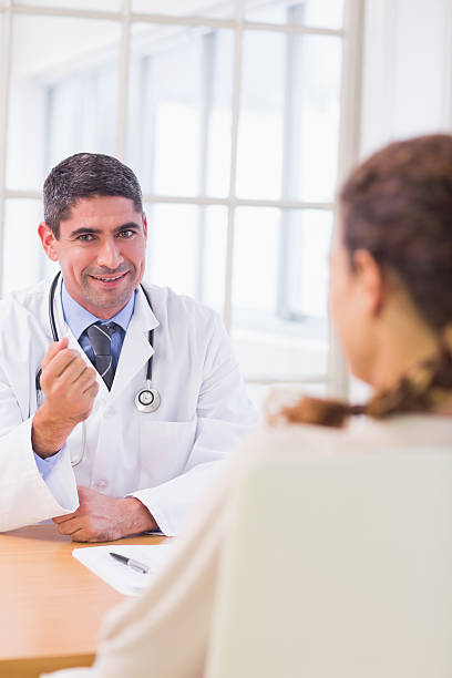 istock Male doctor listening to patient with concentration 493203531