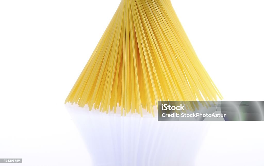 Spaghetti. A bundle of spaghetti isolated on white background. Cooking Stock Photo