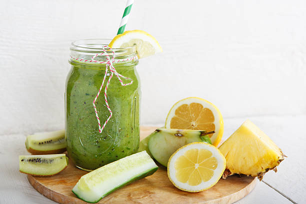 istock Fresh organic green smoothie with salad, apple, cucumber, pineap 493205347