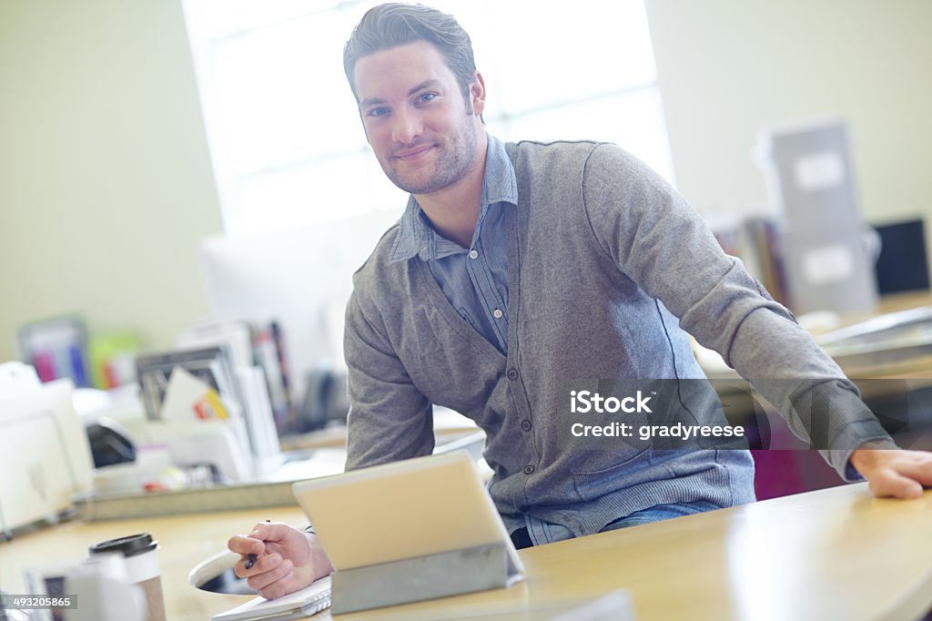 He's ready for inspiration Shot of a casually dressed man using a digital tablet at his deskhttp://195.154.178.81/DATA/i_collage/pu/shoots/784635.jpg Adult Stock Photo