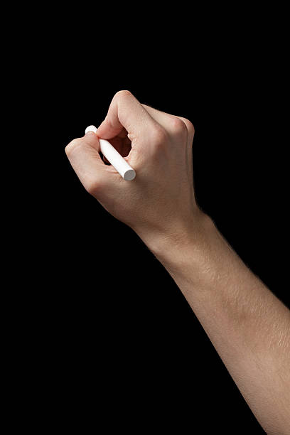istock adult man hand to draw something with chalk 493206155