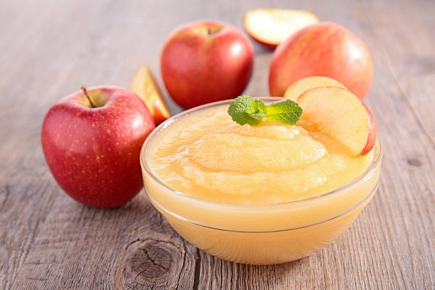bowl of apple sauce bowl of apple sauce compote stock pictures, royalty-free photos & images