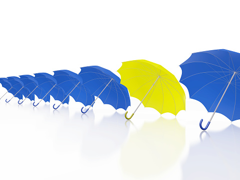 A 3D illustration of a row of blue umbrella, with one yellow umbrella. Ideal for use in uniqueness, competition, leadership and success concepts.