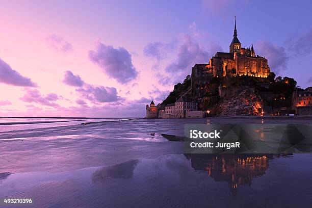 Reflections Of Mont Saintmichel Lit In The Evening Stock Photo - Download Image Now