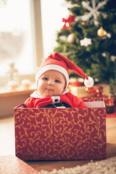 istock Cute baby in a Christmas box 493210756