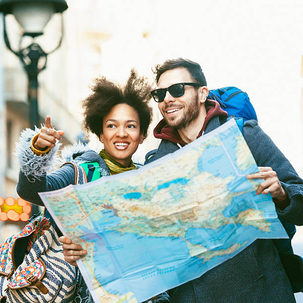 istock Young backpackers couple visiting the city 493213400