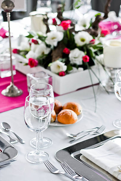 istock Wedding dinner table. Wineglasses,flowers and bread. 493213990
