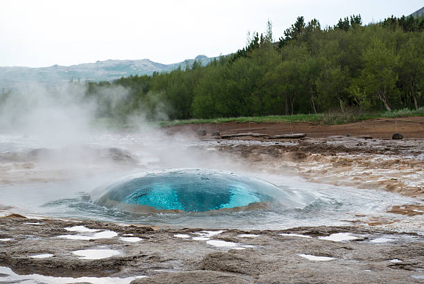 istock Strokkur geyser bubble ready to blow, Iceland 493215842