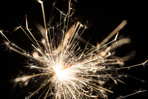 istock sparkler or Bengal fire - scattering sparks 493217448