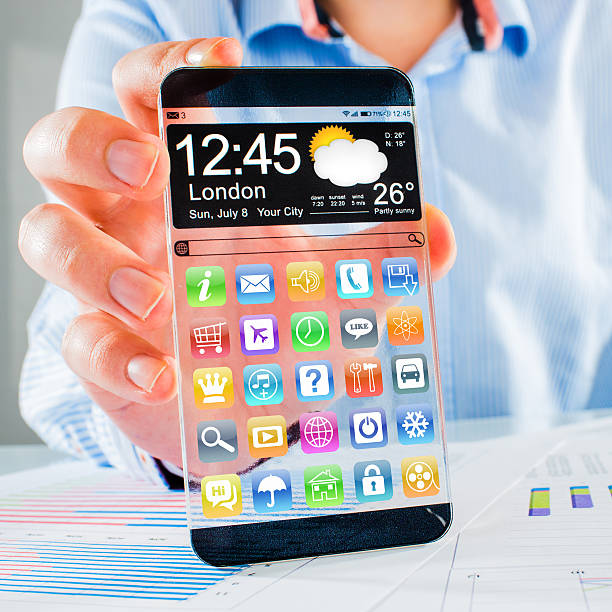 istock Smartphone with transparent screen in human hands. 493217941